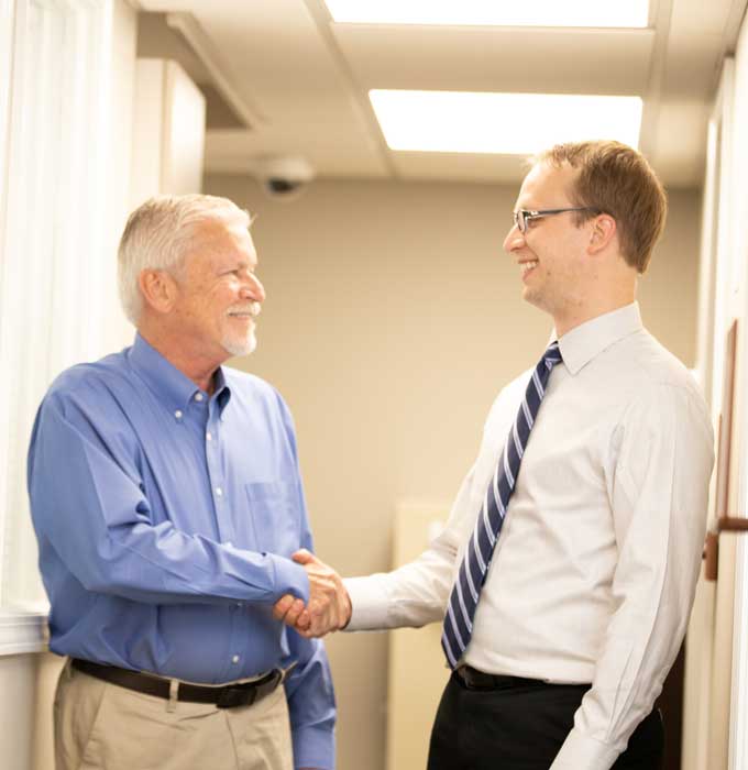 Dr. Laun with dental implant patient