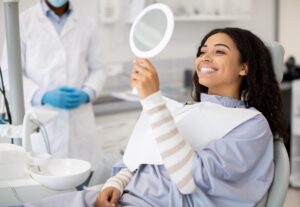Patient consultation in a dental office discussing tooth extraction recovery