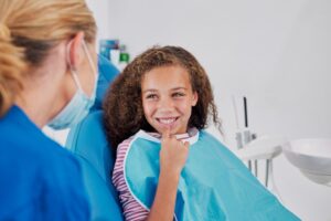 Oral surgeon discussing bone graft procedure with patient