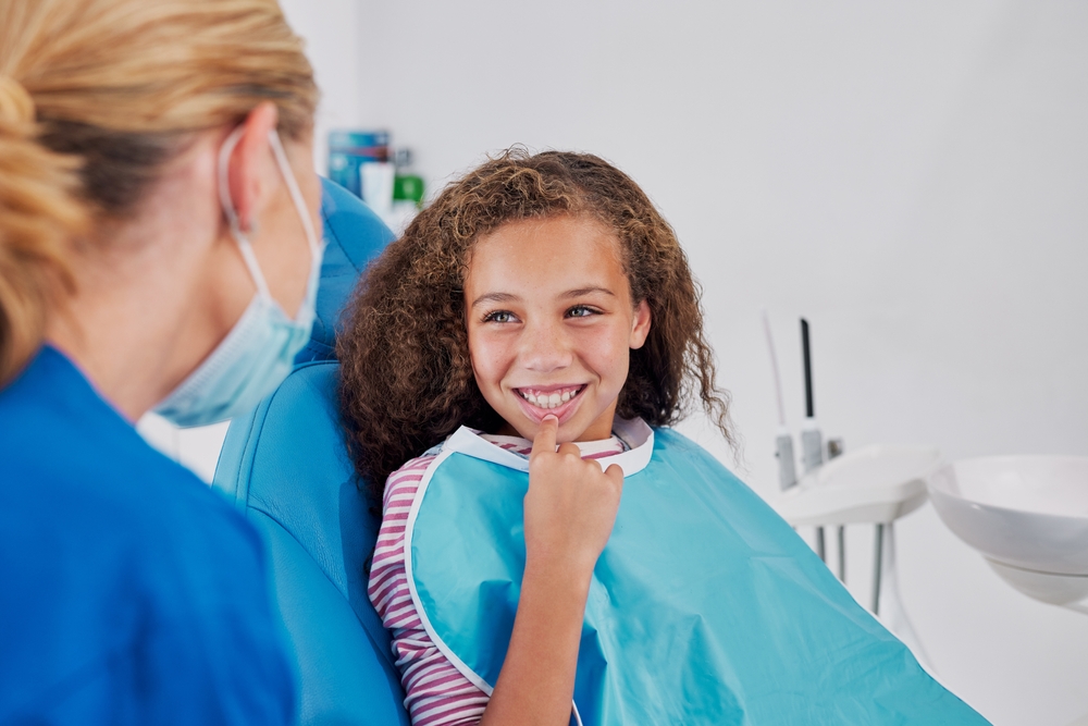 Oral surgeon discussing bone graft procedure with patient