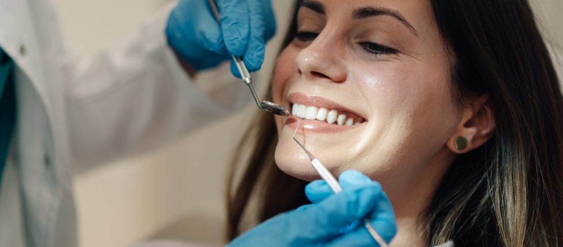 Dentist and dental props working in a dental office, dental props and dentist posing for a photo.