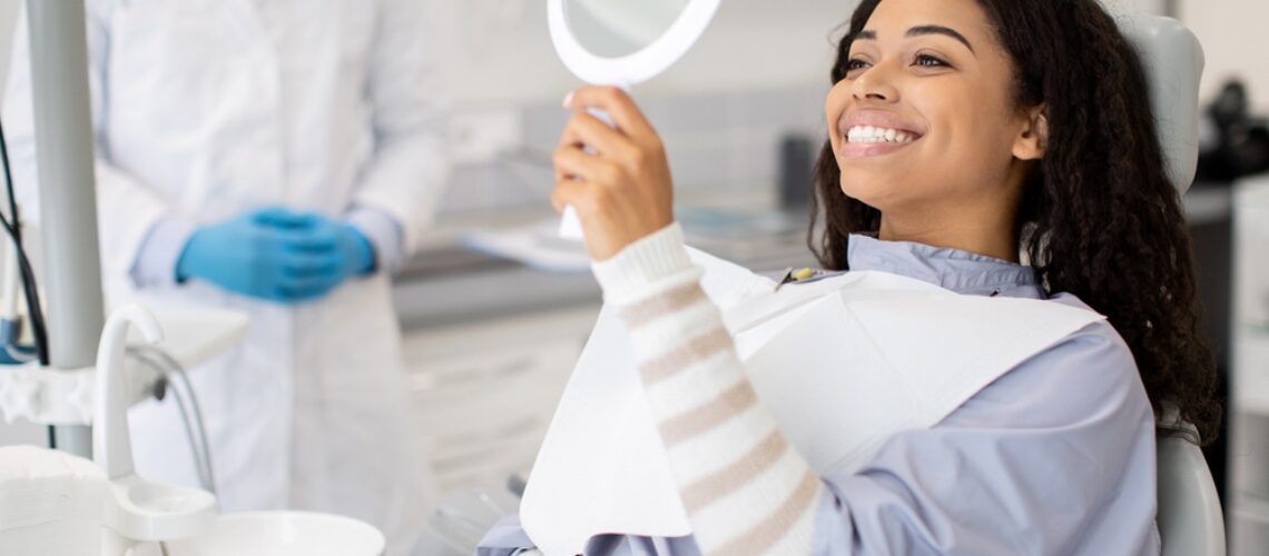 Patient consultation in a dental office discussing tooth extraction recovery